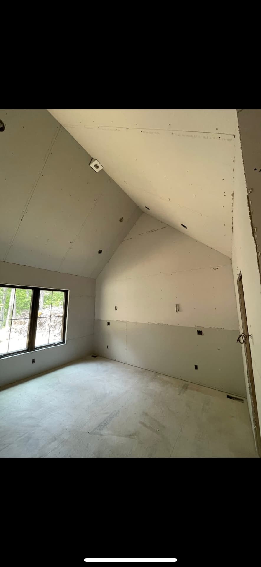 Sloped attic ceiling drywall taped and skim coated in Raymond, NH