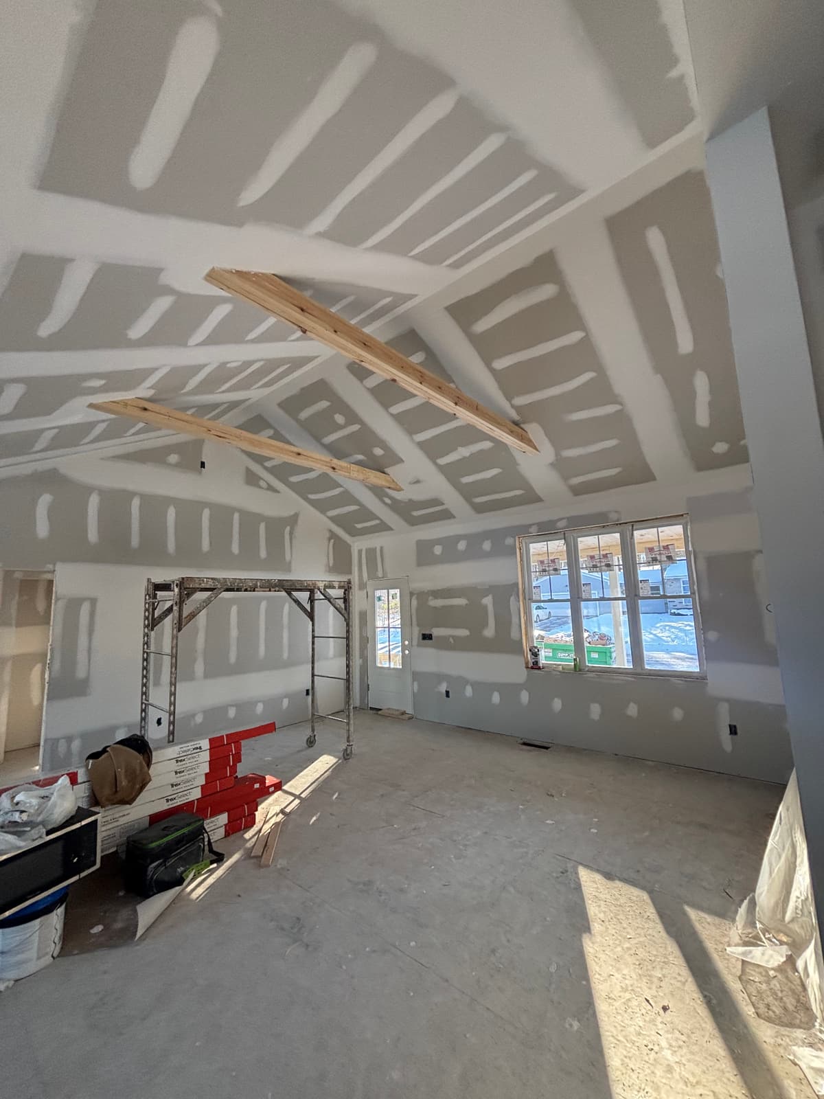 Ceiling opened to the framing before drywall repair in Dover, NH